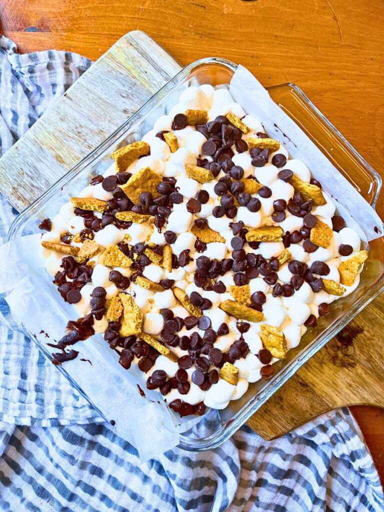 Baked brownies with marshmallow, chocolate, and graham cracker topping.