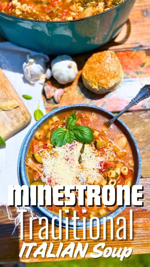 A blue bowl full of minestrone soup. There is more in the background.