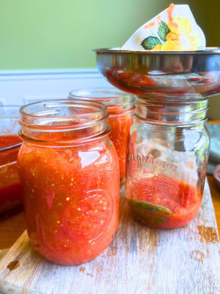 Tomato sauce in a glass canning jar.