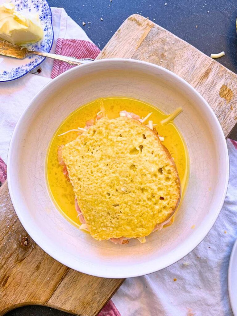 A ham and cheese sandwich coated in an egg batter.