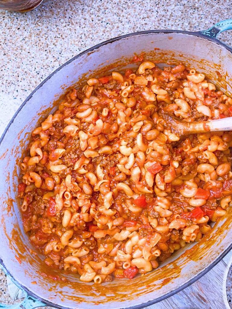 Cooked chili mac and cheese in a large Dutch oven.