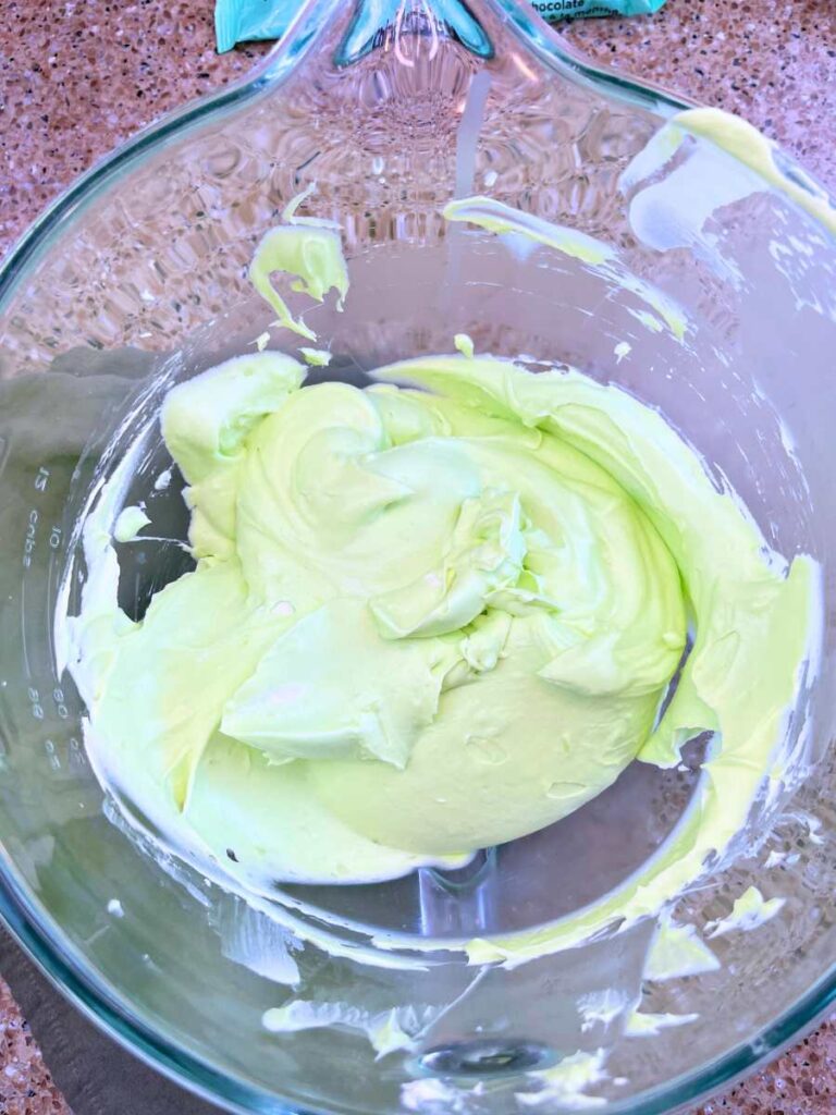 Grasshopper pie filling in a glass bowl.