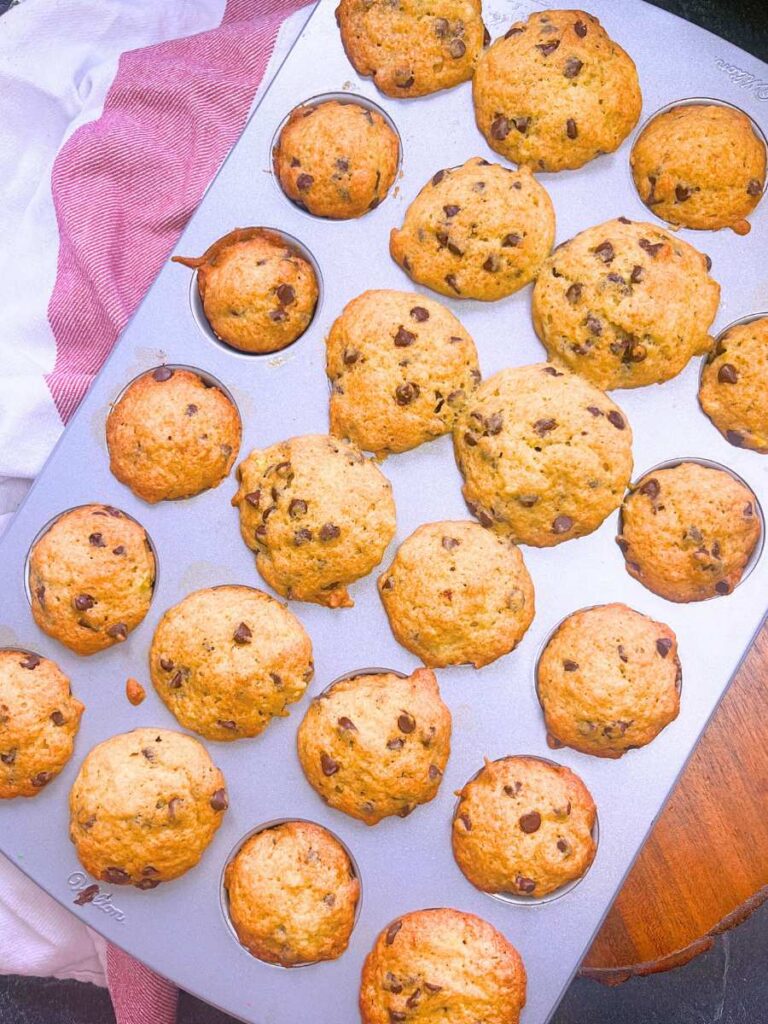 Baked muffins with mini chocolate chips inside.