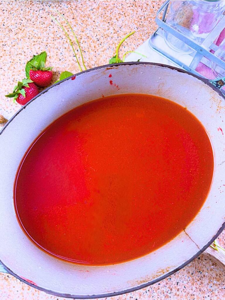 A large pot filled with lemon iced tea.