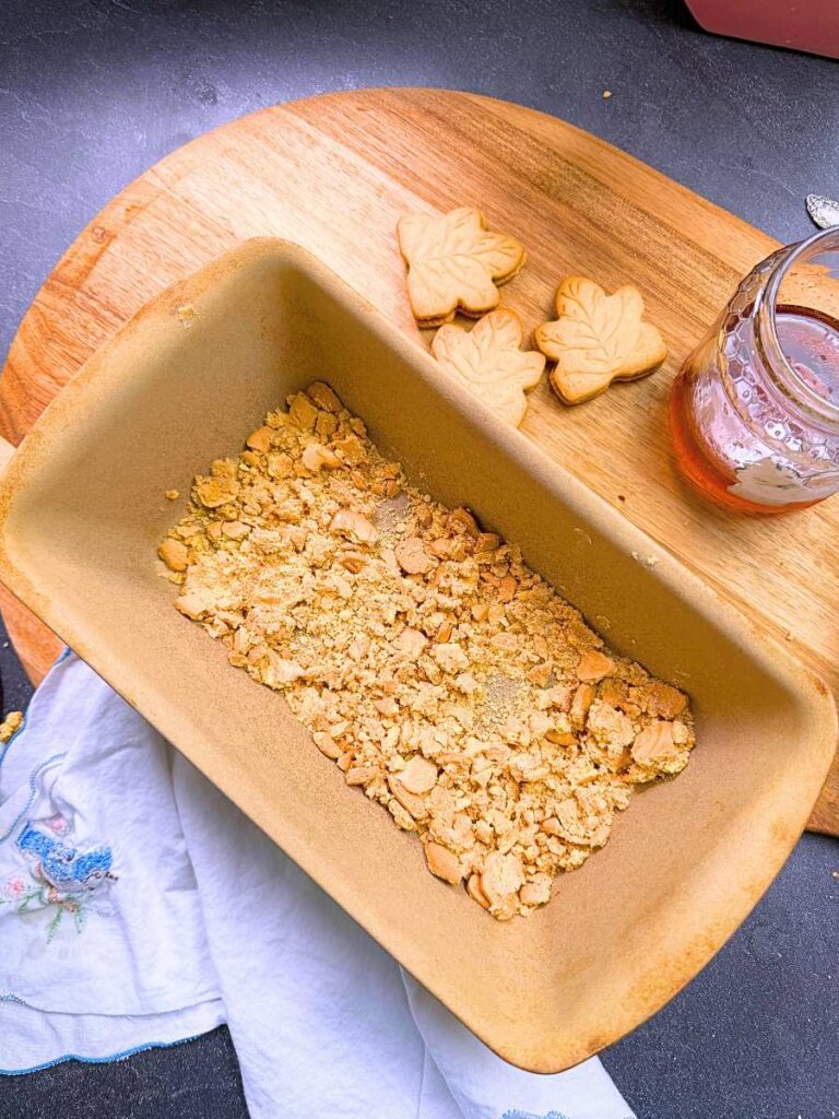 A container of crushed maple cookies.