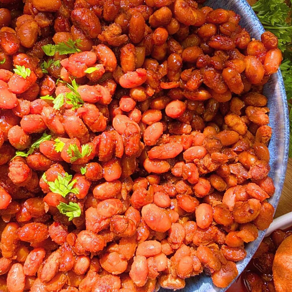 A close up view of a bowl of baked beans.