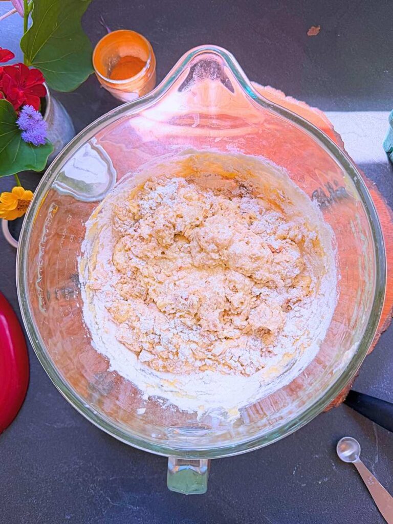 A coffee cake batter inside of a glass bowl.