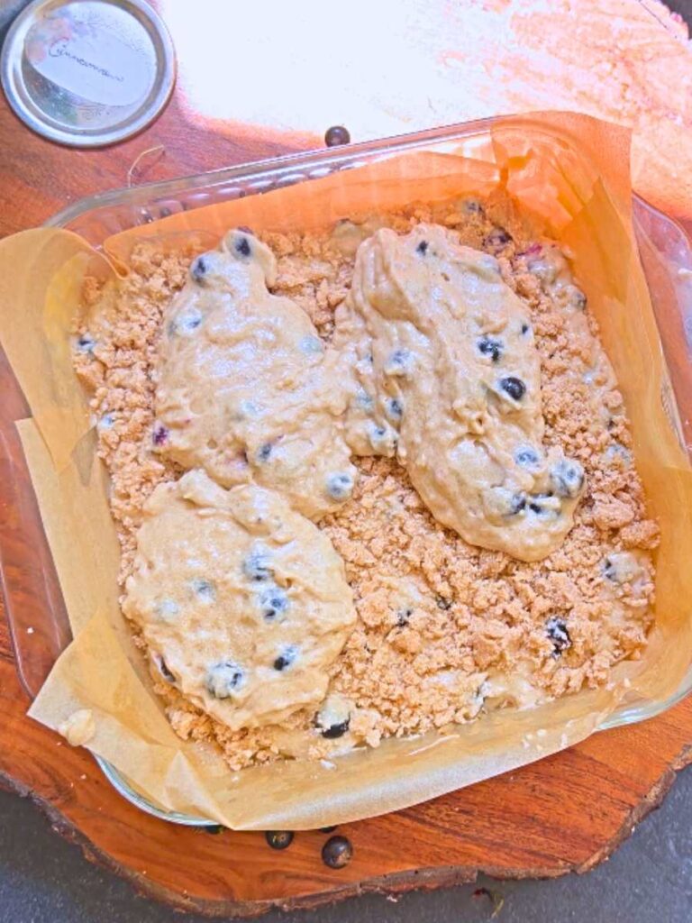 Cake batter layered overtop of a streusel topping.