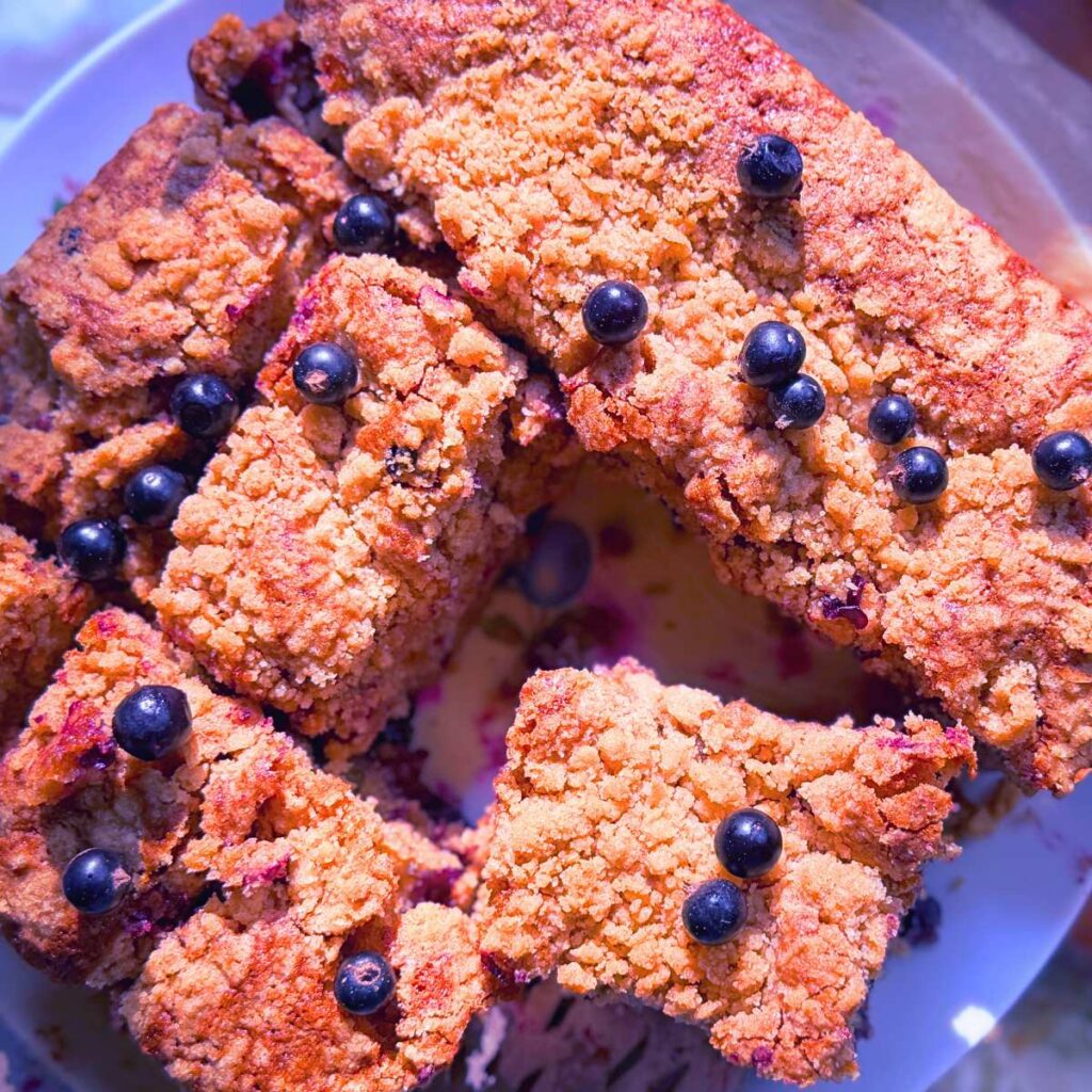A sliced black current coffee cake.
