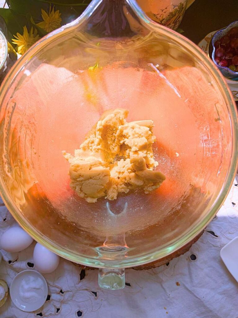 Creamed butter and sugar in a glass bowl.