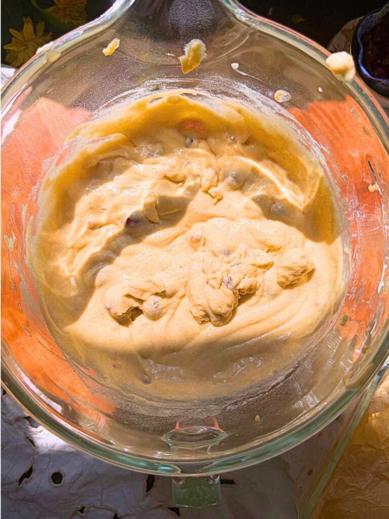 Coffee cake batter with gooseberries inside.