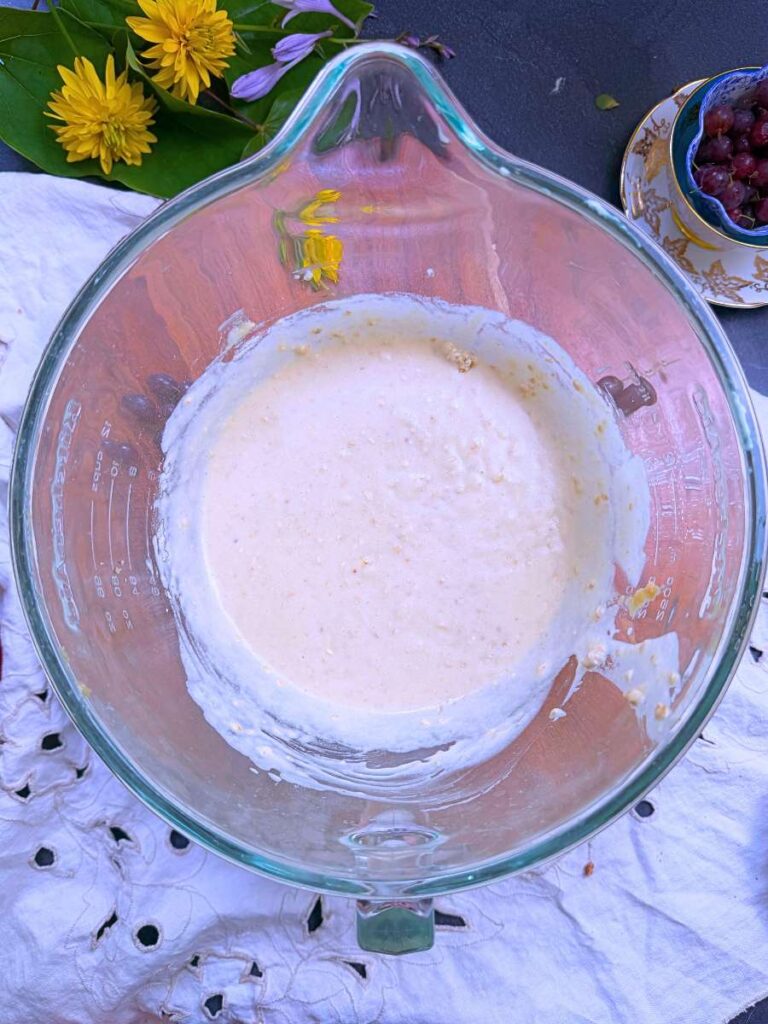 Muffin batter in a large glass bowl.