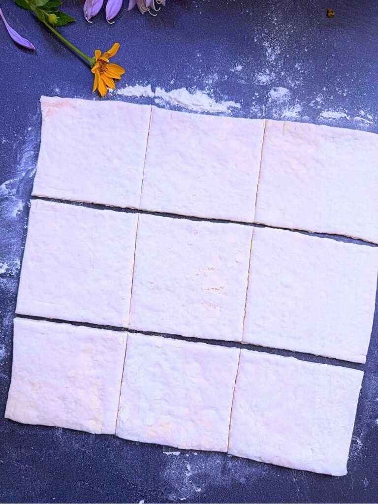 Dough cut into 9 squares.