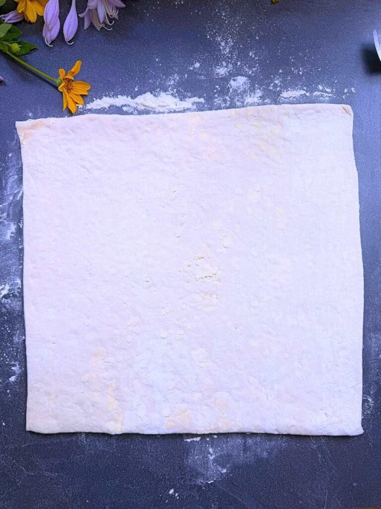 A square of Danish dough on a counter.