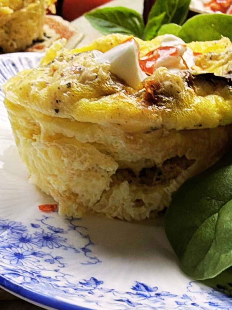 A side view of a muffin tin frittata.