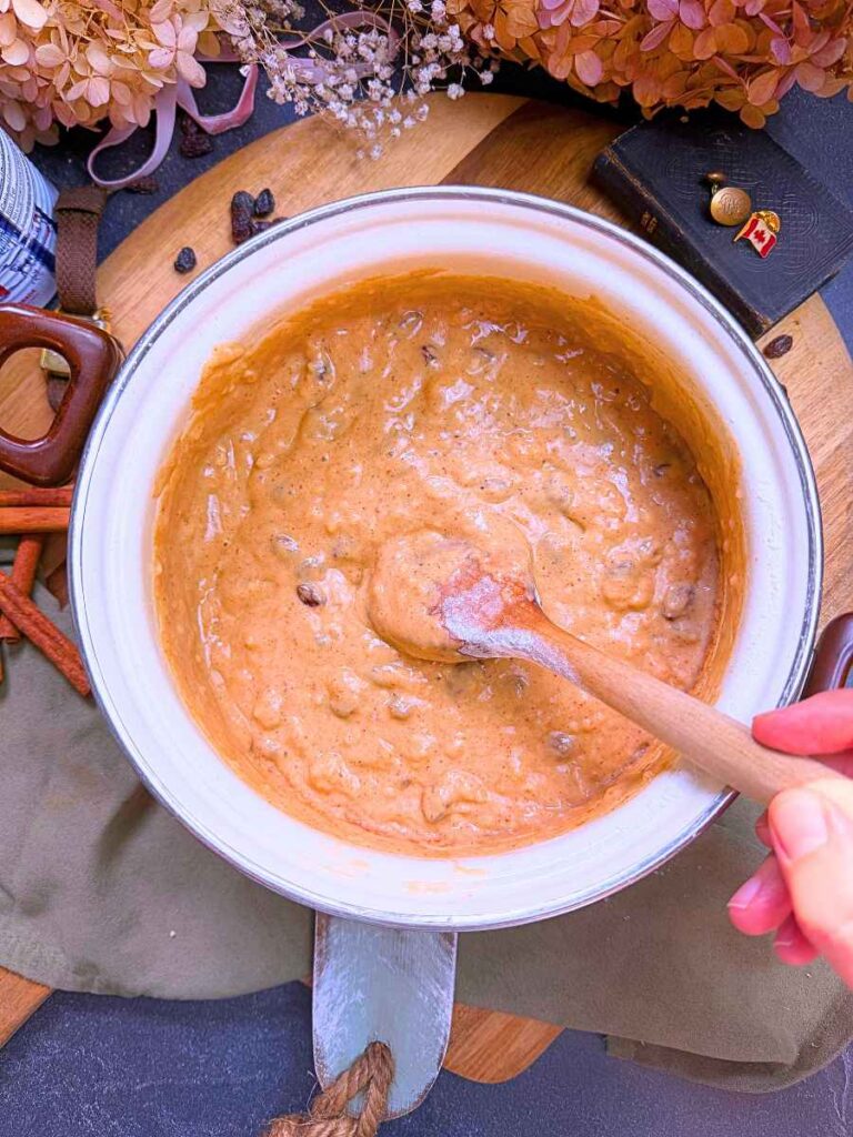 Canadian war cake batter in a white sauce pot.